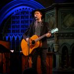 Beck playing on stage