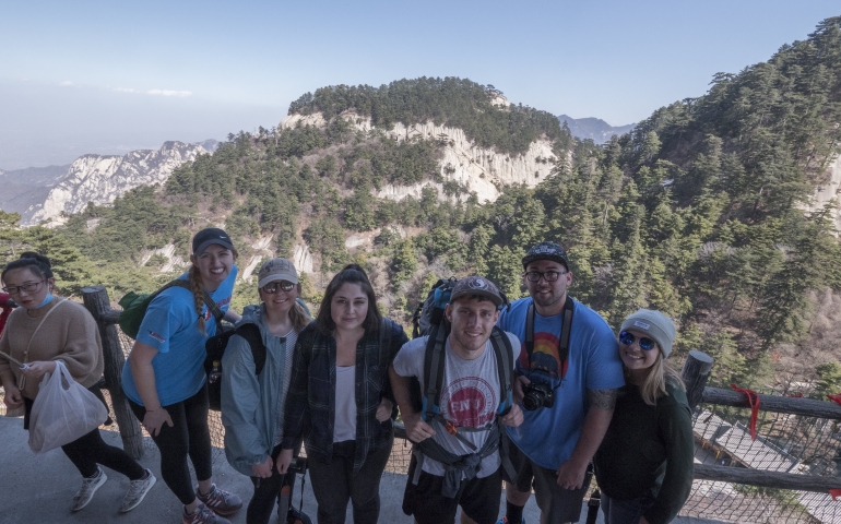 another picture of students standing on a mountain