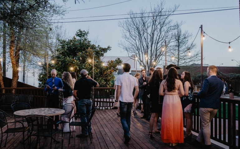 outdoor deck with people talking