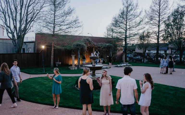 picture of fountain and people talking