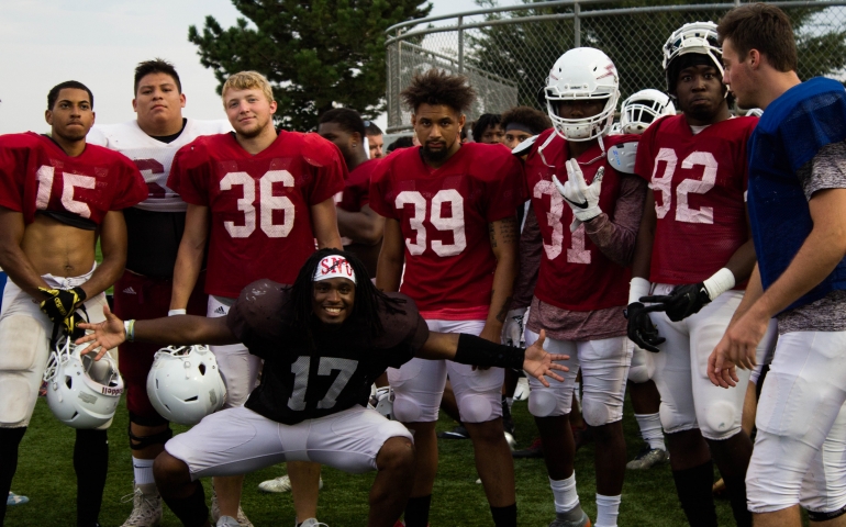 SNU's football team posing before a drill