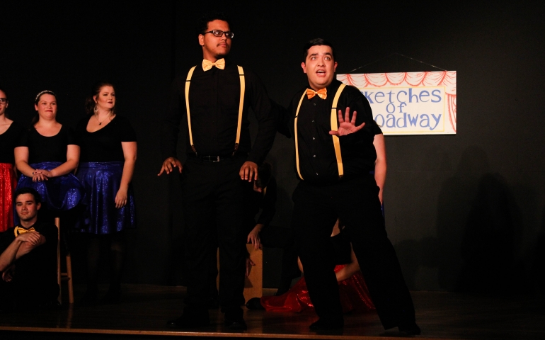 Two men acting on stage