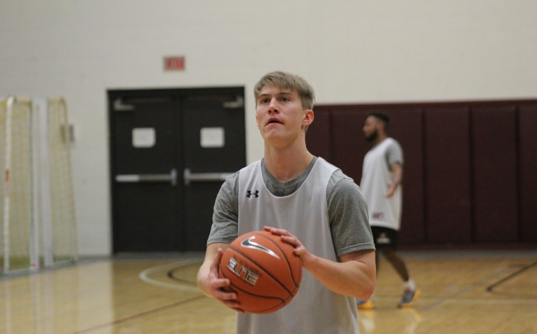 A student shooting a free throw