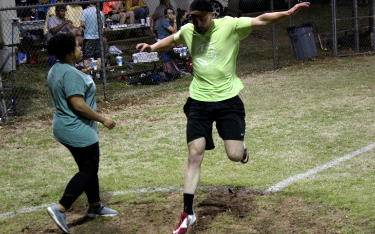 A student hurriedly touches home plate