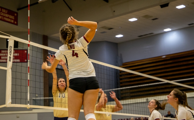 Volleyball player blocking