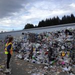 Person looking at piles of trash