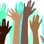 drawing of multicolored arms raised in the air